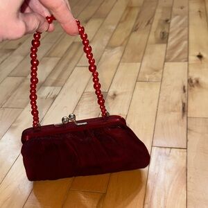 La Regale Elegant Red Iridescent Beaded Handle Clutch with Kisslock closure